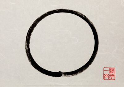 Zen Circle Calligraphy Art by Thich Nhat Hanh in black ink, symbolizing enlightenment, strength, and the universe, painted in a single brushstroke as a traditional Japanese ensō.