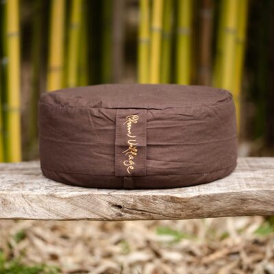 Organic meditation cushion with embroidered Breath and Smile calligraphy, supporting sitting meditation with comfort and stability