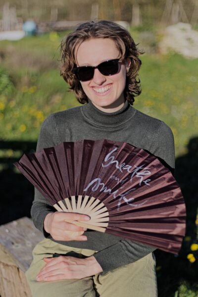Vietnamese calligraphy fan with Breathe and Smile by Thich Nhat Hanh — front view