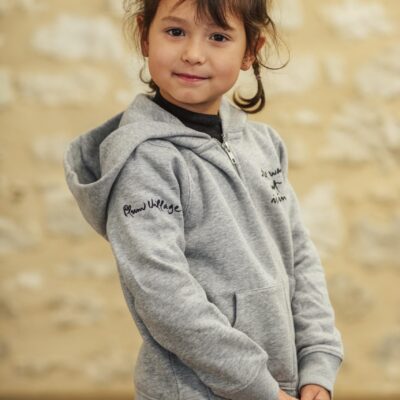 Children wearing Plum Village organic cotton hoodie - The Way Out Is In design