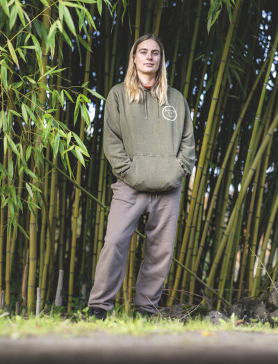 Unisex Plum Village Hoodie -Gardien.es de la Terre in a peaceful natural setting