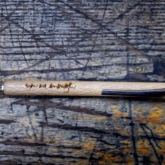 Plum Village Beech Wood Pen, a sustainable ballpoint pen made of FSC-certified beech wood with the engraved message, "You Are Enough.