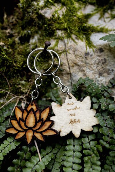 Sustainable keychain made from FSC-certified French poplar wood with engraved meaningful message by Thich Nhat Hanh