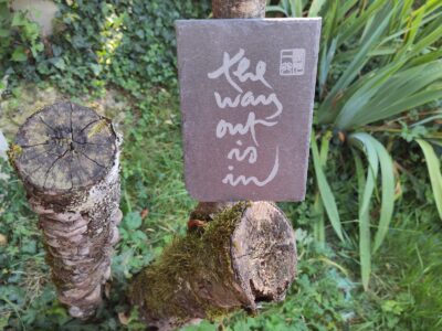 Thich Nhat Hanh’s calligraphy on slate, The Way Out Is In, durable and suitable for indoor and outdoor use.