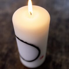 Close-up of the Zen Circle Calligraphy on the candle, symbolizing mindfulness and simplicity